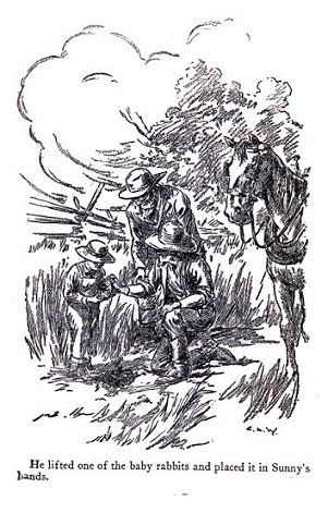 He lifted one of the baby rabbits...